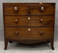 A Georgian mahogany bowfronted chest of drawers. H.87 W.91 D.52cm