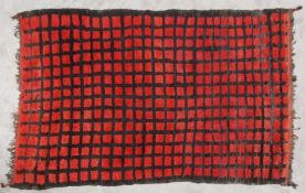 A vintage Moroccan hand woven rug in Berber orange and umber check. L.230 W.156cm