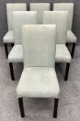 A set of six contemporary dining chairs with stained oak legs in patterned upholstery. H.100cm (