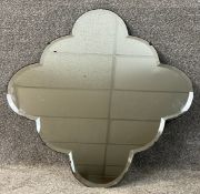 A mid century wall hanging mirror with Art Deco style scalloped bevelled plate. H.64 W.64cm