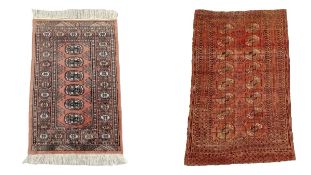 Two Bokhara silk rugs. L.109 W.63cm. H.149 W.93cm.