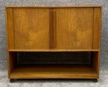 A mid century teak audio cabinet with bifold tambour doors. H.64 W.76 D.37cm