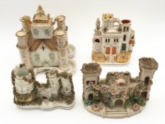 A collection of four 19th century Staffordshire pastille burners; castles. H.25cm (largest).