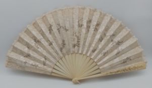 A late 19th century silk, lace, and bone fan with hand painted floral decoration. H.37 W.66cm