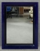 A Kartell Francois Ghost wall mirror designed by Philippe Starck. H.110 W.88cm