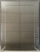 A contemporary mirror in a mirrored glazed frame. H.122 W.92cm