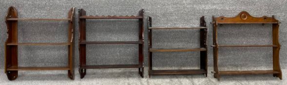 A collection of four 19th century open wall hanging bookshelves; Three mahogany, one oak. H.66 W.
