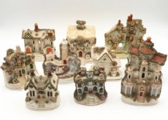A collection of nine 19th century Staffordshire pastille burners; houses. H.17cm (largest).