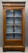 A 19th century continental rosewood full height bookcase fitted with glazed door enclosing