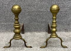 A pair of 19th century brass and cast iron cannonball top andirons or fire dogs. H.34cm (each)