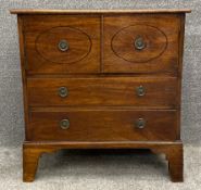 A Georgian mahogany night cabinet with ebony strung inlay and brass handles on splayed bracket