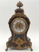 A 19th century Rococo style ormolu mounted and boulle inlaid mantel clock. H.34cm.