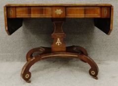 A Regency rosewood drop flap sofa table with brass inlay raised on quadruped pedestal base. H.71 W.