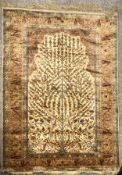 A Persian silk tree of life rug. L.180 W.105cm