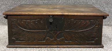 A 17th century oak bible box with carved leaf and branch decoration. H.20 W.58 D.35cm
