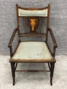 A late 19th century armchair with satinwood urn and swag decoration. H.81cm.