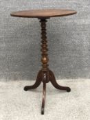 A 19th century oak lamp or occasional table on tripod base. H.74cm.