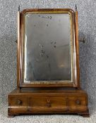A Georgian mahogany swing frame toilet mirror with original plate. H.59 W.40 D.20cm