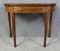 A Georgian mahogany and satinwood strung console tea table with fold over top and double gateleg