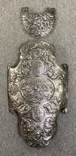 A 19th century European embossed steel parade shield and matching gorget, the central panel with a