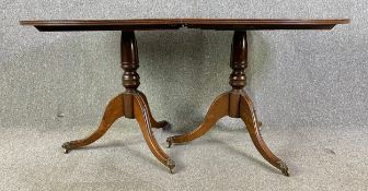 A Georgian style mahogany dining table with extra leaf. H.76 W.166 (212 extended) D.99cm