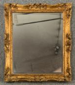 Wall mirror, gilt framed with bevelled plate. H.72 W.62cm