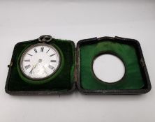 A 19th century hallmarked silver pocket watch in a silver travel case. Case 8.5 x 8.5cm H.3cm, watch