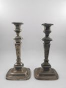 A pair of English hallmarked silver candlesticks, London 1913. H.32cm.