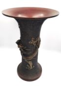 A bronze Japanese Meiji vase decorated with dragons with flared rim. H.24cm.