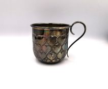 A Tiffany & Co. silver christening cup with heart shaped motif. H.6.5 (to rim) Diameter 7.2cm 115g