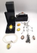 A collection of jewellery, including a cased silver and amber vine design bangle, two pairs of