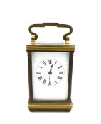 A 19th century brass cased carriage clock with Roman numerals on a white enamel dial. H.12 W.6.5 D.