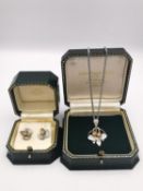A cased bespoke made hop design silver and rose gold plated earring and pendant set by master