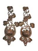 A pair of early 20th century bronze Art Nouveau wall pouches with scrolling water lily designs. L.
