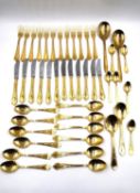 A near full set of German Solingen gold plated cutlery with Rococo style moulded decoration,