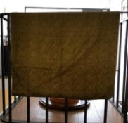 An olive green linen backed wall hanging with embroidered Arabic text, possibly verses from the