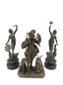 Three spelter figures; one depicting a man and dog with a glass lantern, hunting horn and