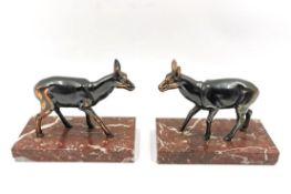 A pair of French Art Deco patinated copper deer on marble bases. H.13 W.16 D.8.2cm (each)