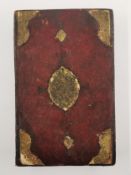 A leather bound and gilt tooled fold-out book of Persian hand painted miniatures and texts, about 30