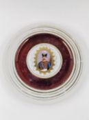 An early 20th century gilt and hand painted plate with a portrait of Naser al-Din Shah Qajar. Dia.