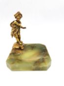 An green onyx pin tray with an ormulu girl wrapped in a toga/cloth with flowers in her hair. H.13cm