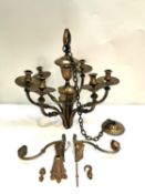 A six branch brass chandelier and a pair of similar wall sconces. Chandelier H.48, chain L.65,