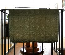 A pale green linen backed textile wall hanging with embroidered Arabic text, possibly verses from