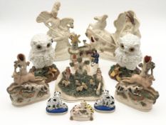 A collection of 19th century flatback figures: animal groups. H.21cm (largest).
