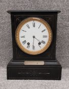 A 19th century slate mantel clock with eight day movement and white enamel dial. H.34.5 W.28 D.16.