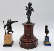 Three 19th century bronze figures, cherubs/putti on marble plinths; one with a laurel wreath, one