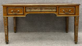 A Louis XVI style ormolu mounted, leather topped desk or writing table. The top having an ormolu
