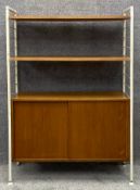 A mid century Staples Ladderax teak modular shelving system with maker's label. H.133 W.94 D.36cm
