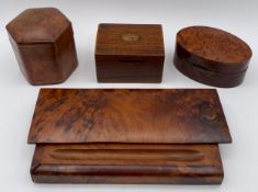 A collection of four boxes to include a burr walnut pen box, a burr yew oval box, an Italian leather