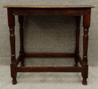 A mid century carved oak lamp or occasional table. H.74 W.77 D.46cm